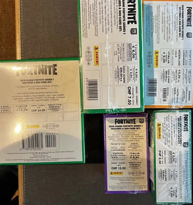 Rear panels of 2019 Panini Fortnite Series 1 Mega Blaster Boxes showing printed regional pricing for Switzerland, Italy and other markets