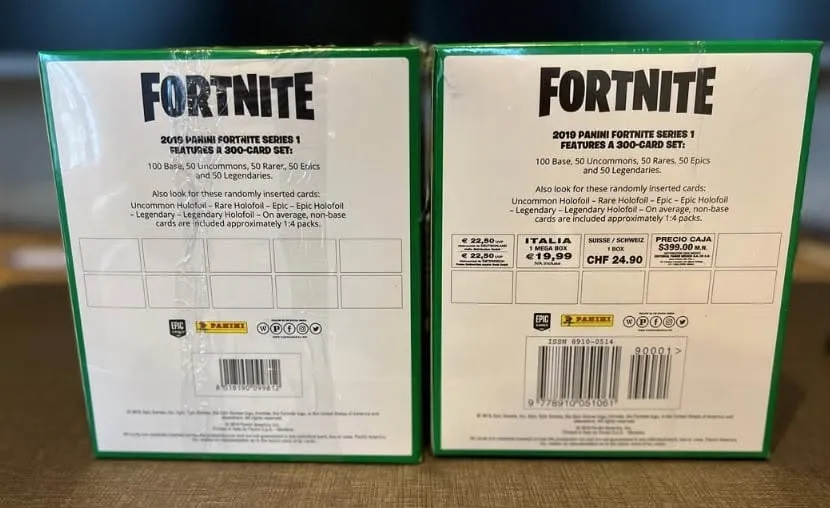 Two 2019 Panini Fortnite Series 1 Mega Blaster Boxes side by side, one rear panel without regional pricing and one with German, Italian, Swiss and Mexican pricing panels